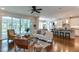 Bright living room with hardwood floors, an open floor plan, and access to a screened porch at 721 Shelley Rd, Raleigh, NC 27609