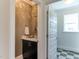 Stylish powder room features elegant wallpaper and a modern vanity at 721 Shelley Rd, Raleigh, NC 27609