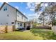 A spacious backyard features a patio, screened-in porch and lush lawn with a fenced perimeter at 802 Knollwood Dr, Apex, NC 27502