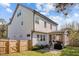 The lovely backyard features a patio, screened-in porch and lush lawn with a fenced perimeter at 802 Knollwood Dr, Apex, NC 27502