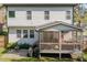 This backyard has a screened-in porch with patio and seating area at 802 Knollwood Dr, Apex, NC 27502
