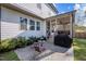 Backyard featuring a screened-in porch, outdoor seating area, and well-maintained lawn at 802 Knollwood Dr, Apex, NC 27502