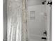 Bathroom with white subway tile and white shower curtain at 802 Knollwood Dr, Apex, NC 27502