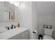 Modern bathroom with a granite-topped sink and toilet with stylish fixtures at 802 Knollwood Dr, Apex, NC 27502