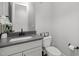 Clean half bathroom with sleek vanity and fixtures at 802 Knollwood Dr, Apex, NC 27502