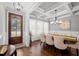 Elegant dining room with coffered ceilings, hardwood floors, and stylish chandelier at 802 Knollwood Dr, Apex, NC 27502