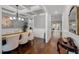 Elegant dining room with coffered ceilings, hardwood floors, and stylish chandelier at 802 Knollwood Dr, Apex, NC 27502