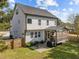 Back of house with nice yard, patio area with grill, and screened in porch at 802 Knollwood Dr, Apex, NC 27502