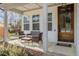 Charming front porch with outdoor seating, perfect for relaxing and enjoying the neighborhood at 802 Knollwood Dr, Apex, NC 27502