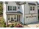 Inviting front porch with comfortable seating and a view of the landscaped yard at 802 Knollwood Dr, Apex, NC 27502