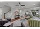 Open-concept living room with staircase and kitchen in the background at 802 Knollwood Dr, Apex, NC 27502
