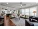 Large open concept living room with kitchen and oversized island, great for entertaining at 802 Knollwood Dr, Apex, NC 27502