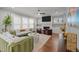 Cozy living room featuring a fireplace, large windows, and comfortable seating at 802 Knollwood Dr, Apex, NC 27502