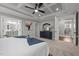 Spacious bedroom with tray ceilings and ensuite bathroom provides comfort and refined style at 802 Knollwood Dr, Apex, NC 27502