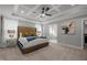 Stately main bedroom with tray ceiling, plush carpet and access to the luxurious bathroom at 802 Knollwood Dr, Apex, NC 27502