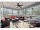 Spacious screened porch with ample seating, ceiling fan, and views of the backyard at 802 Knollwood Dr, Apex, NC 27502