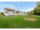 Spacious backyard featuring a large lawn, fence, and tasteful landscaping elements at 803 Driftwood Dr, Gibsonville, NC 27249