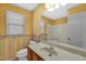 Bathroom featuring a unique vanity, decorative wallpaper, and bath tub for a vibrant, classic look at 803 Driftwood Dr, Gibsonville, NC 27249