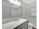 Bathroom features a marble vanity, tiled shower, and neutral color scheme for a serene experience at 803 Driftwood Dr, Gibsonville, NC 27249