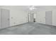 Bright bedroom featuring neutral walls, grey carpet, and ensuite bathroom access; ready for customization at 803 Driftwood Dr, Gibsonville, NC 27249