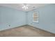This bedroom offers ample natural light, neutral carpet, and a ceiling fan to keep you comfortable year-round at 803 Driftwood Dr, Gibsonville, NC 27249
