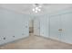 This bedroom features neutral walls, soft carpeting, and convenient closet space for comfortable living at 803 Driftwood Dr, Gibsonville, NC 27249