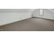 This bonus room features vaulted ceilings and natural light, ready for your personal touch at 803 Driftwood Dr, Gibsonville, NC 27249