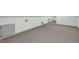Spacious bonus room with neutral carpet, ample storage, and potential for versatile use at 803 Driftwood Dr, Gibsonville, NC 27249