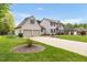 Well-maintained two-story home with an attached two-car garage and a wide driveway at 803 Driftwood Dr, Gibsonville, NC 27249