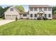 Charming two-story home with a lush green lawn, two-car garage, and inviting curb appeal at 803 Driftwood Dr, Gibsonville, NC 27249