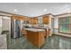 Eat-in kitchen featuring a stainless steel refrigerator and granite countertops at 803 Driftwood Dr, Gibsonville, NC 27249