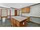 Eat-in kitchen featuring a central island and granite countertops at 803 Driftwood Dr, Gibsonville, NC 27249