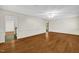 Spacious living room with hardwood floors, bright lighting, and decorative trim at 803 Driftwood Dr, Gibsonville, NC 27249