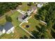 Aerial view of residential houses with fenced yards and green lawns at 810 Mulberry Rd, Spring Hope, NC 27882
