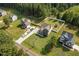 Aerial view of residential houses with nice green lawns and long driveways at 810 Mulberry Rd, Spring Hope, NC 27882