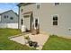 Back patio with a concrete pad, and an entrance to the home at 810 Mulberry Rd, Spring Hope, NC 27882