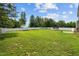 Expansive backyard featuring a lush lawn, white fence, and ample space for recreation at 810 Mulberry Rd, Spring Hope, NC 27882