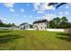 Spacious backyard with a trampoline, lush green lawn, and privacy fence at 810 Mulberry Rd, Spring Hope, NC 27882