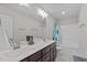 Bathroom with double sinks, tile flooring, and a shower and bath combination at 810 Mulberry Rd, Spring Hope, NC 27882