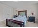 Bedroom featuring floral bedding, neutral walls, and double closet at 810 Mulberry Rd, Spring Hope, NC 27882