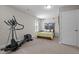 Bedroom with an exercise machine, a comfortable bed, neutral colors, and ample natural light at 810 Mulberry Rd, Spring Hope, NC 27882