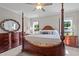 Primary bedroom featuring a luxurious four-poster bed, dresser and natural light at 810 Mulberry Rd, Spring Hope, NC 27882