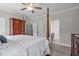 Bedroom with ensuite bathroom, four-poster bed and walk-in closets at 810 Mulberry Rd, Spring Hope, NC 27882