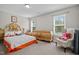 Bedroom with neutral walls, carpet, and natural light from a windows at 810 Mulberry Rd, Spring Hope, NC 27882