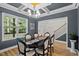 Spacious dining room with hardwood floors, wainscoting, decorative ceiling, and a view to the staircase at 810 Mulberry Rd, Spring Hope, NC 27882