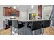 Kitchen island with granite countertops, pendant lighting, and seating adjacent to stainless microwave at 810 Mulberry Rd, Spring Hope, NC 27882