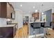 Open kitchen with stainless appliances, wood cabinets, and breakfast bar at 810 Mulberry Rd, Spring Hope, NC 27882