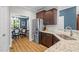 Modern kitchen with stainless steel appliances, granite counters, and dark wood cabinetry at 810 Mulberry Rd, Spring Hope, NC 27882