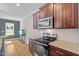 Modern kitchen features granite counters, stainless appliances and hardwood floors at 810 Mulberry Rd, Spring Hope, NC 27882