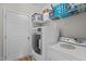 Efficient laundry area with modern washer, dryer, and convenient shelving at 810 Mulberry Rd, Spring Hope, NC 27882